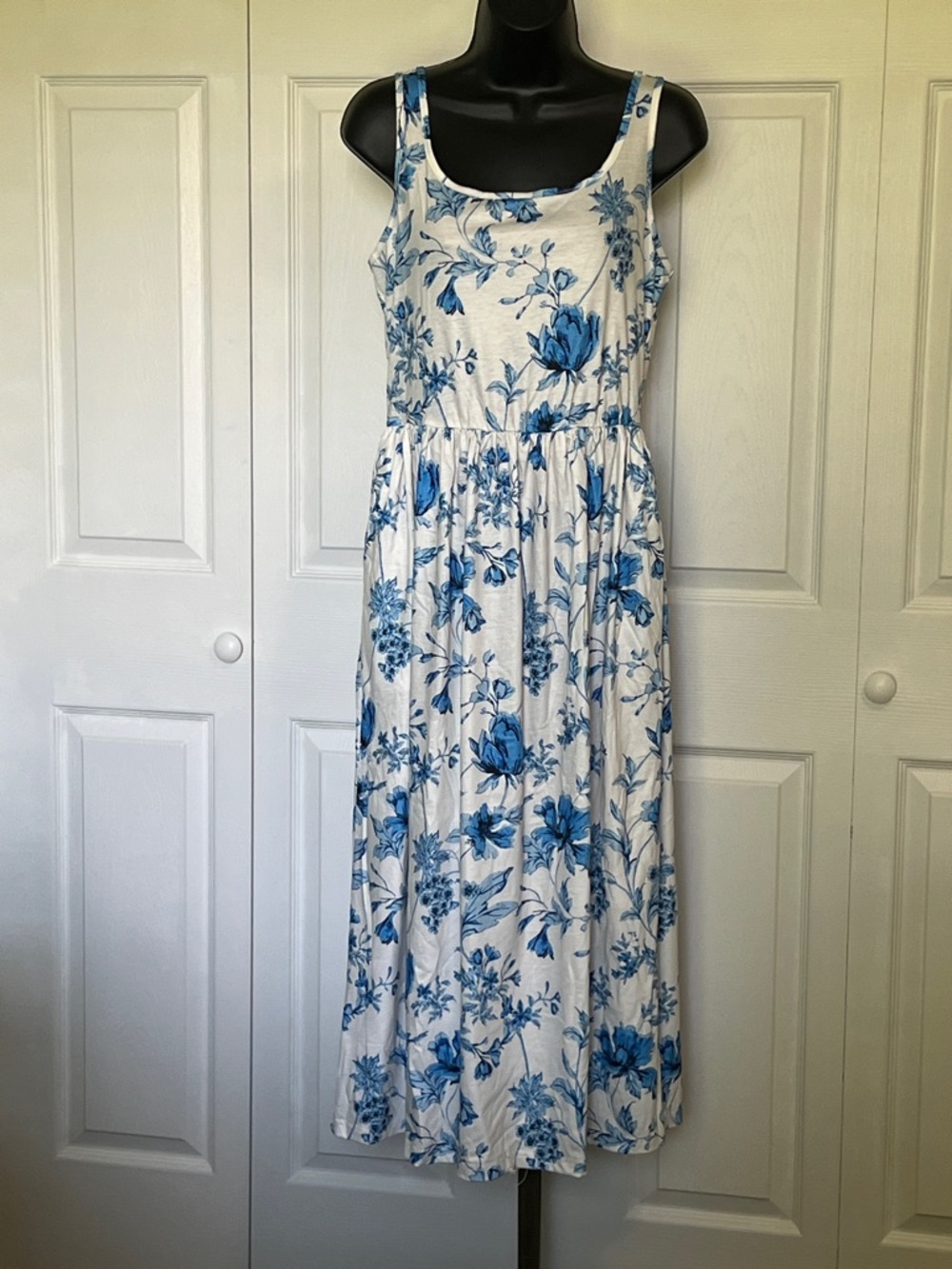 Sleeveless White Maxi Dress with Blue Floral Print